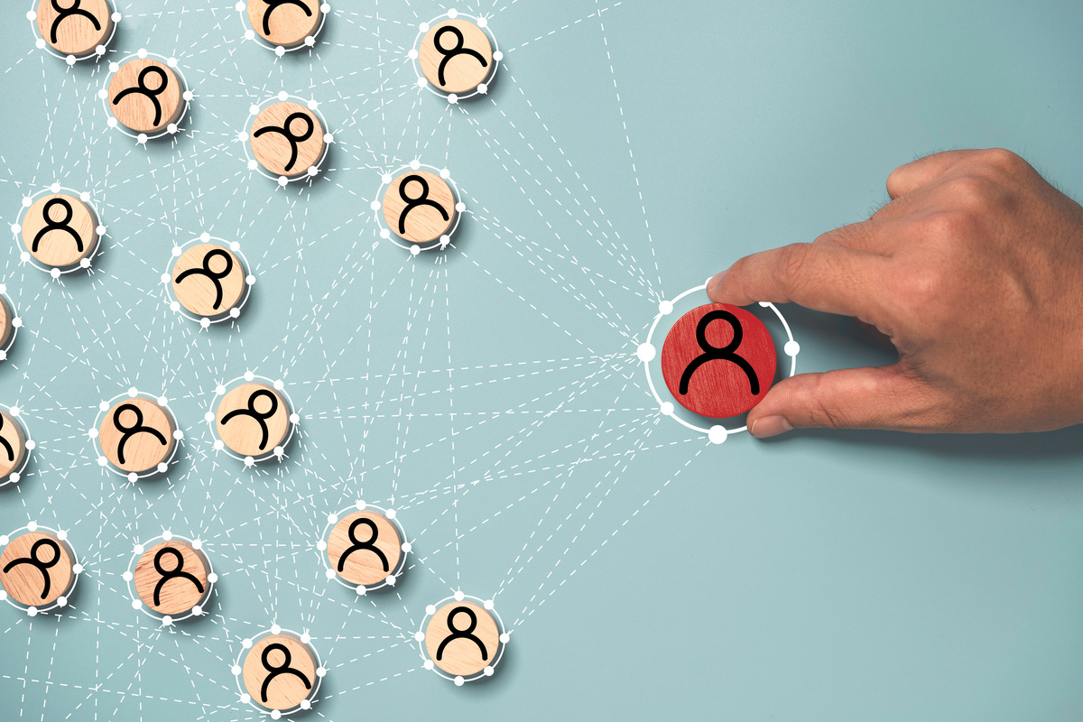 Hand holding to select human icon with connection linkage for Hu